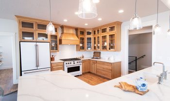 A white kitchen with wood cabinets. A white kitchen with wood cabinets.