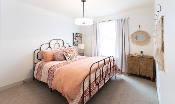 A bedroom with a bed and a dresser. A bedroom with a bed and a dresser.