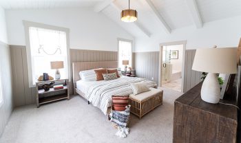 A bedroom with a bed and a dresser. A bedroom with a bed and a dresser.