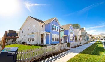 A row of houses on a street. A row of houses on a street.