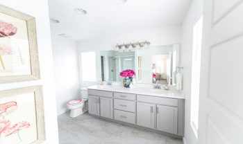 A bathroom with a white sink and mirror. A bathroom with a white sink and mirror.