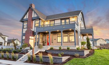 A home with a large front porch and landscaping. A home with a large front porch and landscaping.