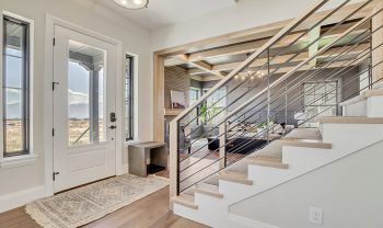 A staircase leading to a living room in a home. A staircase leading to a living room in a home.