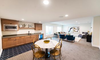 A kitchen, dining room and living room in a home. A kitchen, dining room and living room in a home.