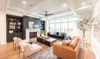 A living room with couches and a fireplace. A living room with couches and a fireplace.