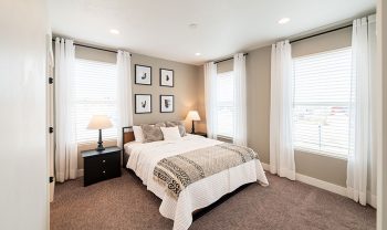 A bedroom with a bed and a bedside table, located in Manhattan. A bedroom with a bed and a bedside table, located in Manhattan.