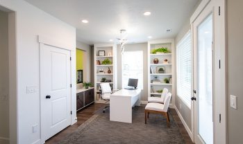 A home office with a desk and chair, overlooking a beautiful Manhattan roof deck. A home office with a desk and chair, overlooking a beautiful Manhattan roof deck.