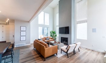 A living room with hardwood floors and a fireplace. A living room with hardwood floors and a fireplace.