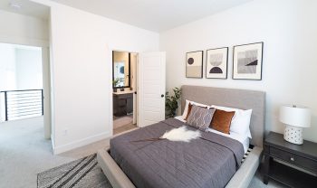 A bedroom with a bed and a dresser. A bedroom with a bed and a dresser.