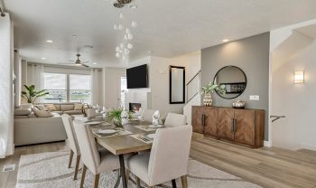 A dining room and living room in a modern home, featuring a major league floor plan. A dining room and living room in a modern home, featuring a major league floor plan.