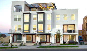 A white and gray building with balconies. A white and gray building with balconies.
