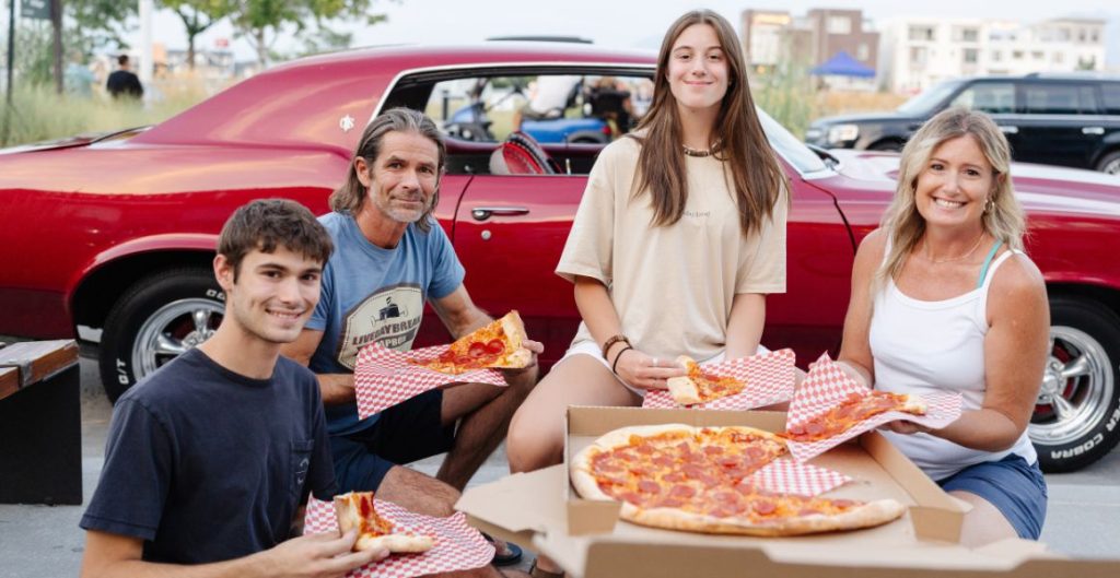 Menzer family eating pizza at Soda Row | Daybreak, UT
