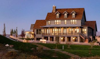 A large house on a hillside at dusk. A large house on a hillside at dusk.